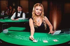 Live dealer studio setup showing multiple gaming tables with professional lighting